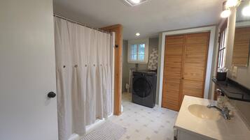 Shower, hair dryer, towels, soap