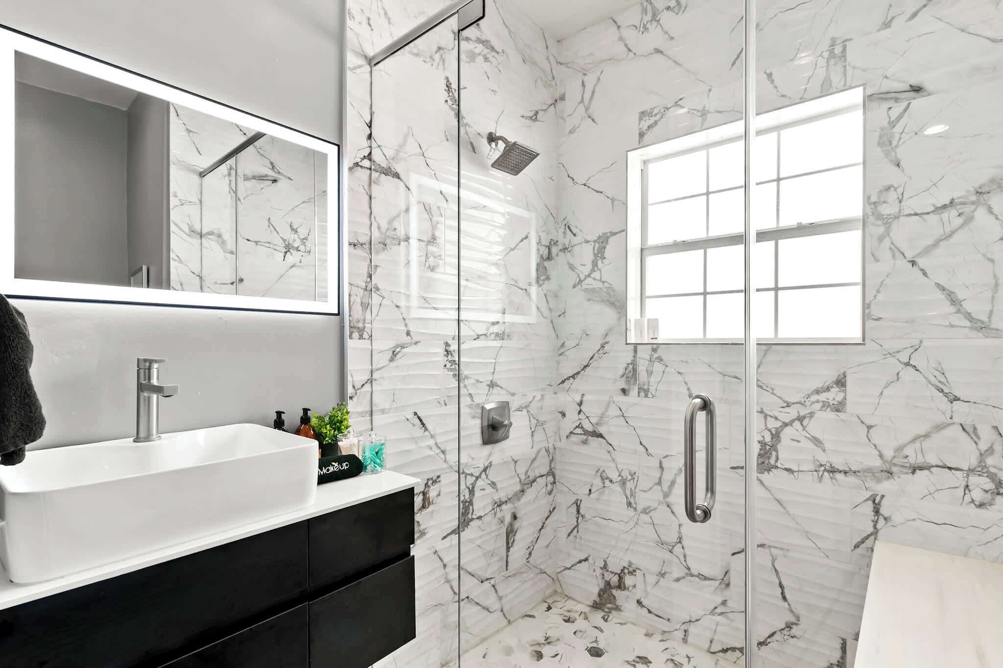 Shower, hair dryer, towels, shampoo