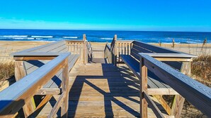 A wooden boardwalk leading to the beach with a clear view of the ocean. - A Sense of Porpoise - 4 BR Oceafront Townhome in Southern Shores (Southern Shores)