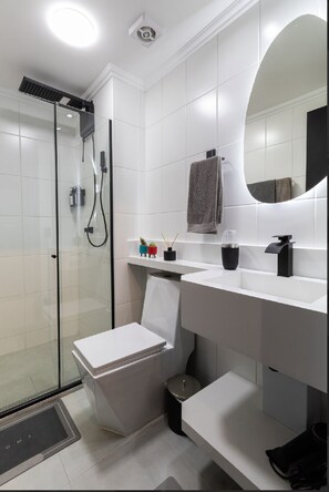 Shower, hair dryer, towels, soap