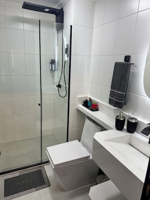 Shower, hair dryer, towels, soap