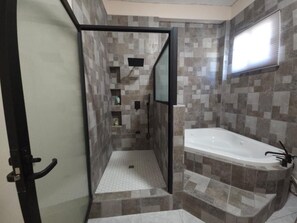 Shower, jetted tub, towels, soap