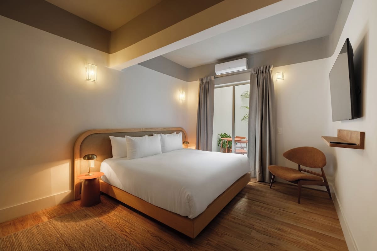 Deluxe Room, 1 King Bed | Premium bedding, down comforters, in-room safe, individually decorated