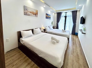 Family Quadruple Room, City View | Blackout drapes, iron/ironing board, free WiFi