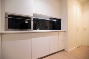 Departamento | Cocina privada | Refrigerador, lavavajillas y utensilios de cocina 