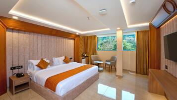 A modern hotel room with a large bed, bedside table, and a TV.