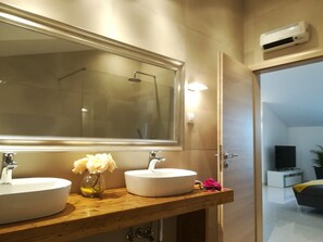 Shower, hair dryer, towels, soap
