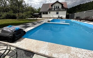 Seasonal outdoor pool, pool umbrellas, pool loungers
