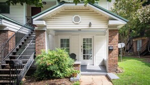 A two-story house with a front porch, a brick foundation, and a mailbox. - Tri-City Terrace – 3 Units/Groups/Games/Fun (Birmingham)
