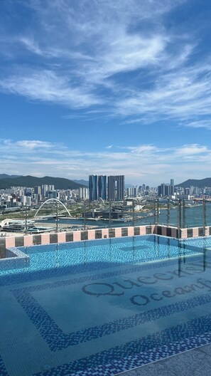 Seasonal outdoor pool, open 11:00 AM to 8:00 PM, pool umbrellas