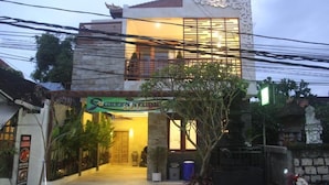 A two-story building with a sign for 'Green Studio' at the entrance. - 1Bedroom Studio Apartment Private Pool (Seminyak)