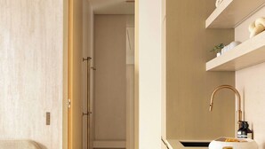 A modern kitchen with a wooden countertop, a sink, and a built-in oven. - Luxury Flat -2br/8p- Madeleine/saint Honore (Paris)