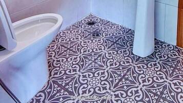 Superior Room | Bathroom | Shower, hair dryer, towels, soap