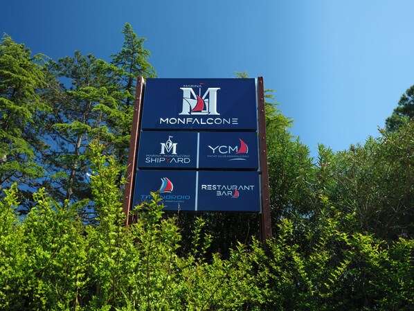 A sign with logos for Monfalcone Marina, Yacht Club Monfalcone, Shipyard, and Restaurant Bar. - Boutique Guesthouse - Marina Monfalcone (Monfalcone)