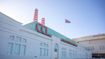 A building with 'COL' prominently displayed on the facade, a flagpole with a flag, and a sign for 'CENTRO DE CIENCIA Y QUIMICA'.