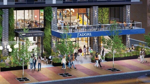An outdoor café area with seating and a café named 'CAFE TARTINE' and 'J'ADORE' visible.