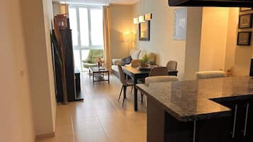 Family Apartment, 2 Bedrooms, Kitchen, City View | Living area | Flat-screen TV