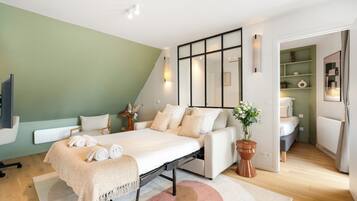 Deluxe Penthouse, City View | Living area | Smart TV