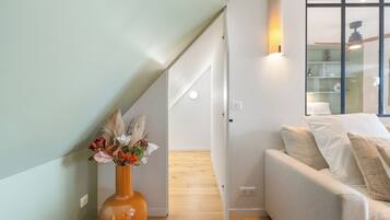 Deluxe Penthouse, City View | Living area | Smart TV