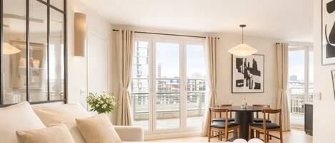 Deluxe Penthouse, City View | Living area | Smart TV