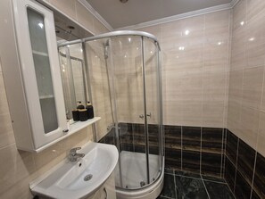 Shower, hair dryer, towels, soap