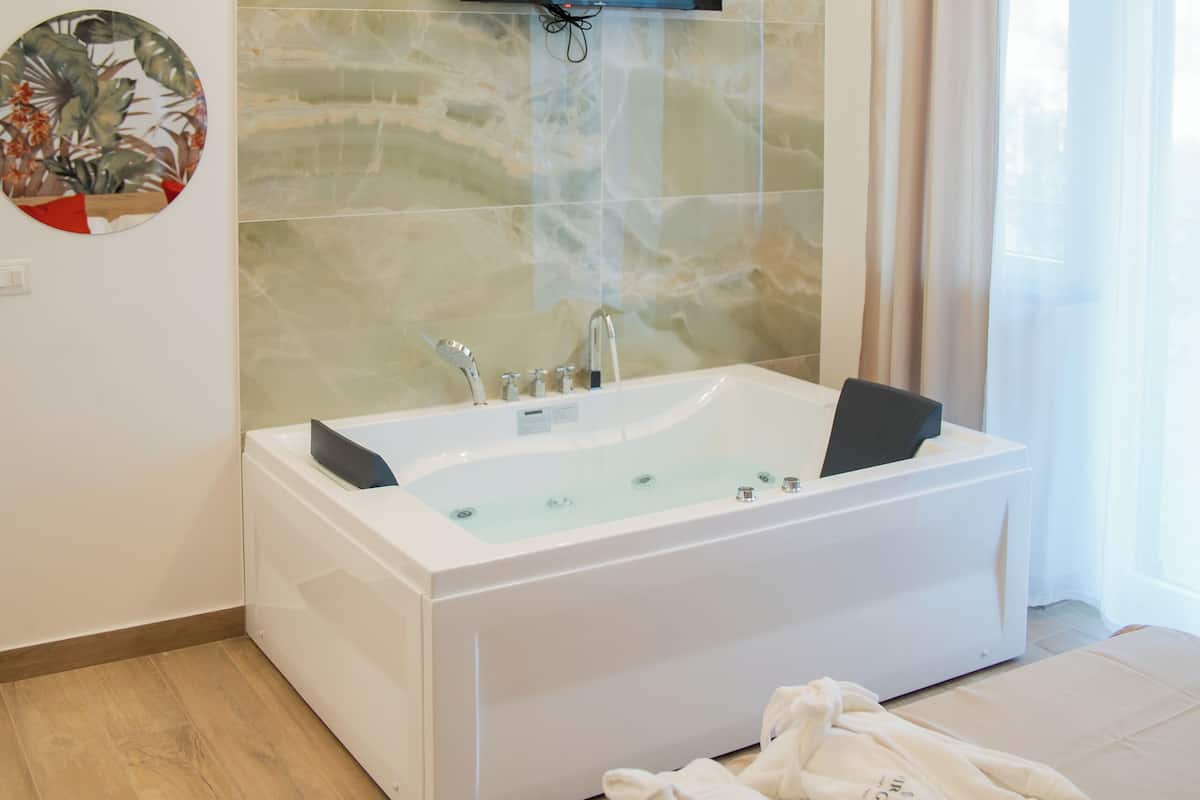 Luxury Suite, Garden View | In-room safe, desk, laptop workspace, soundproofing