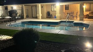 A pool area with a clear view of the pool, a grill, and outdoor furniture. - Charming, very quiet house (Lake Havasu City)