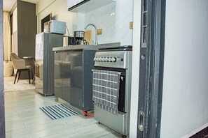 Mini-fridge, microwave, oven, stovetop