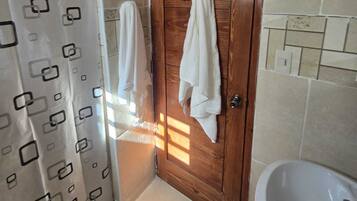Shower, towels, soap, toilet paper