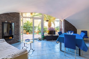 Apartment (1 Bedroom) | Living area | 32-inch Smart TV with cable channels