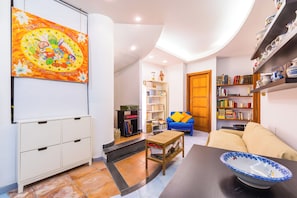 Apartment (1 Bedroom) | Living area | 32-inch Smart TV with cable channels