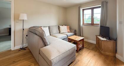 You’ll love the stylish step-free layout and peaceful countryside setting.