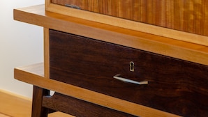 A wooden cabinet with a drawer and a shelf. - Setubal Boutique Apartments III (Setubal)