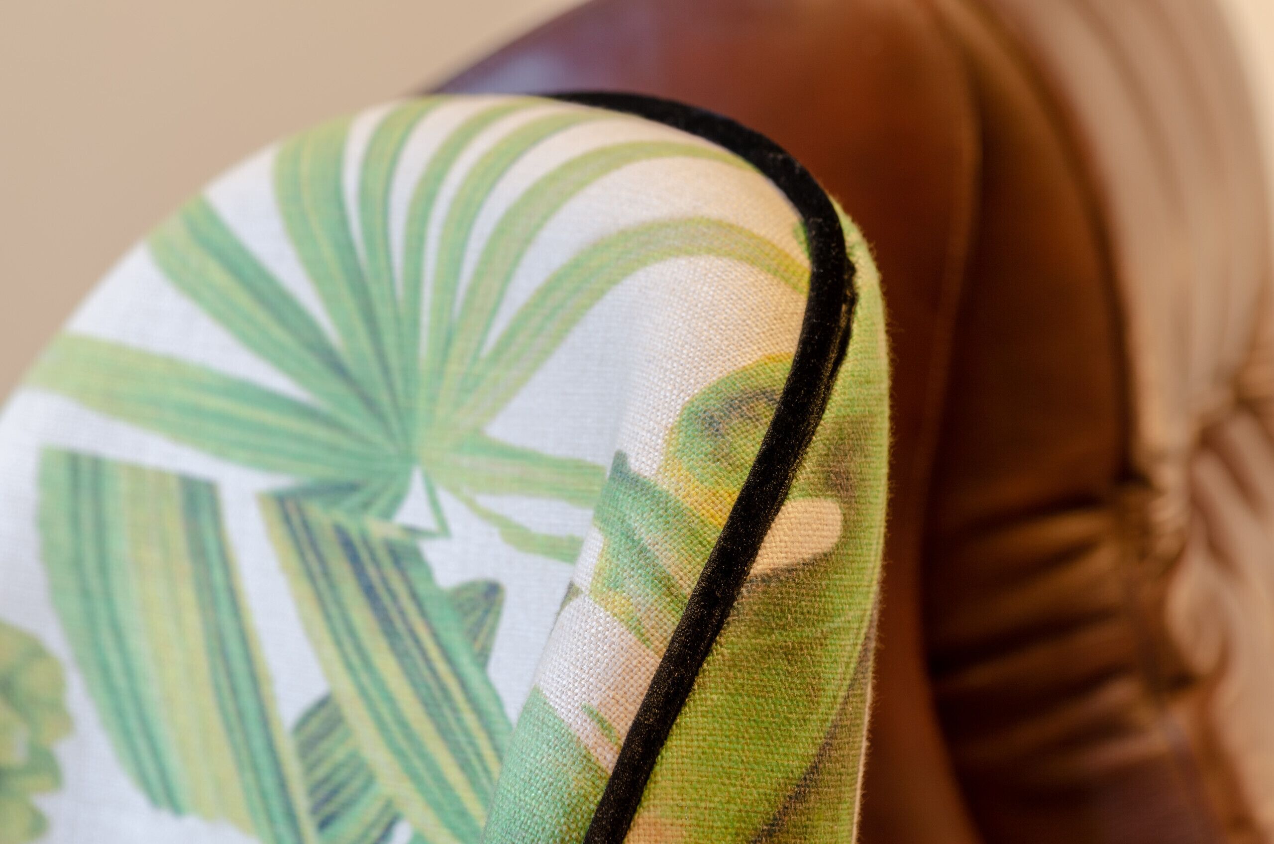 A close-up of a fabric with a leaf pattern.