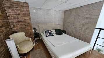 Familie appartement, niet-roken | Een gratis minibar, verduisterende gordijnen, geluiddichte muren