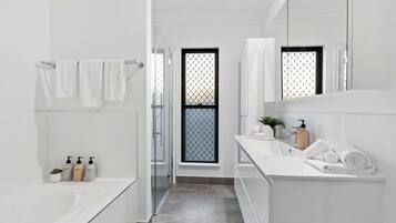 Shower, hair dryer, towels, shampoo