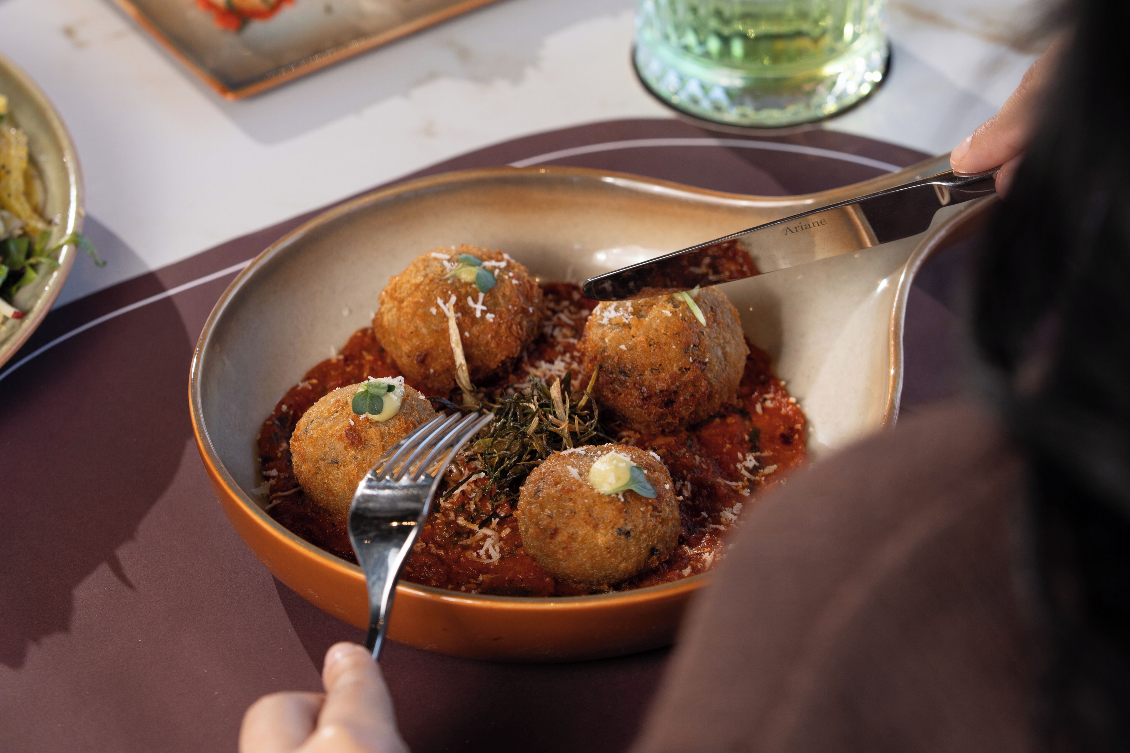 A plate of food with a fork and knife.