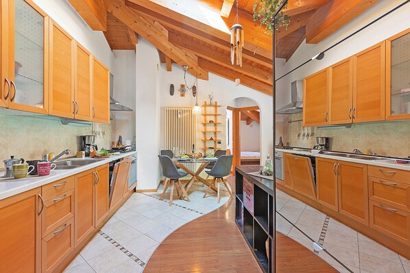 Family Apartment, 2 Bedrooms (Torbole On the Moon) | Private kitchen | Fridge, oven, stovetop, dishwasher