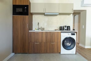 Fridge, microwave, stovetop, coffee/tea maker