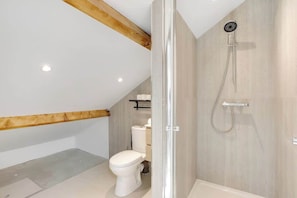 Shower, hair dryer, towels, shampoo