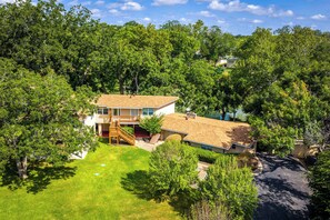 Exterior - Riverfront | Private Deck | Games | Scenic Views! (Seguin)