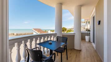 Suite, Balcony, Sea View | Outdoor dining