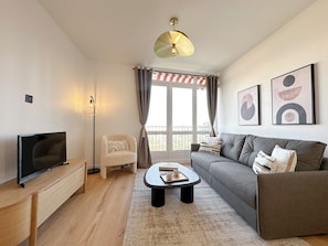 Appartement Deluxe, vue ville | Coin séjour