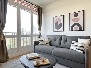 Appartement Deluxe, vue ville | Coin séjour
