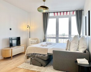 Deluxe Apartment, City View | Living area | Smart TV