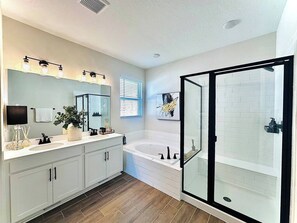 Shower, hair dryer, towels, toilet paper
