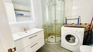 Shower, hair dryer, towels, soap