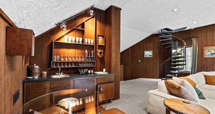 Step into Time Capsule Tower, a retro 70s escape with 5 themed bedrooms, movie room, hot tub, sauna, arcade & more. Centrally located near Northern Michigan golf, lakes, skiing, & off-road and snowmobile trails with access to a community pool.