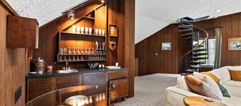 Step into Time Capsule Tower, a retro 70s escape with 5 themed bedrooms, movie room, hot tub, sauna, arcade & more. Centrally located near Northern Michigan golf, lakes, skiing, & off-road and snowmobile trails with access to a community pool.