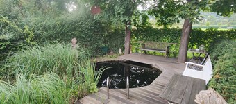 Stylish listed house. With sauna, fitness studio and a small garden. Bathing pond.